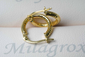 Candongas Tallada en oro 18 quilates Candongas Tallada en oro 18 quilates