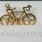 Dije Bicicleta con circón blanco en oro 18 quilates.